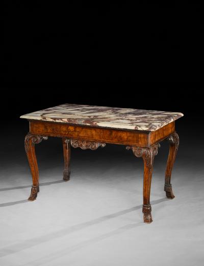 A GEORGE II PERIOD CARVED WALNUT SIDE TABLE