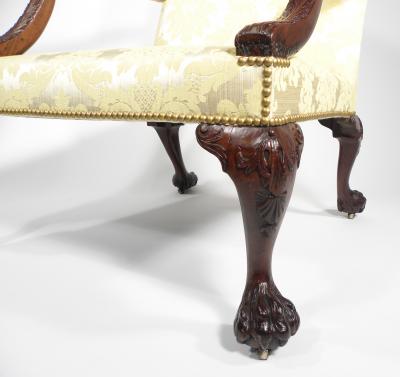 A GEORGE II STYLE MAHOGANY LIBRARY ARMCHAIR