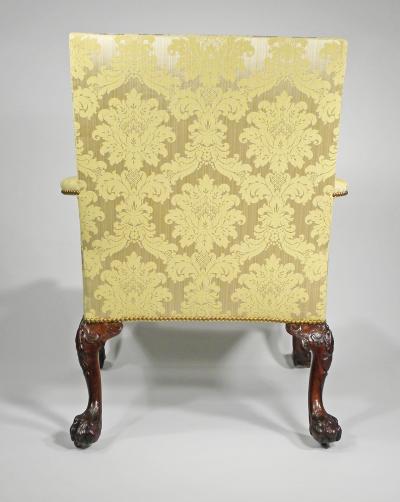 A GEORGE II STYLE MAHOGANY LIBRARY ARMCHAIR