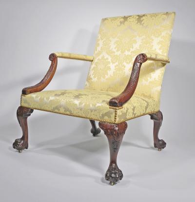 A GEORGE II STYLE MAHOGANY LIBRARY ARMCHAIR
