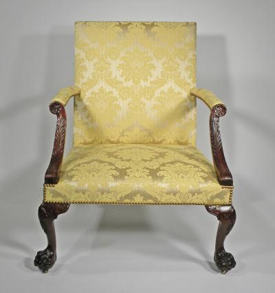 A GEORGE II STYLE MAHOGANY LIBRARY ARMCHAIR
