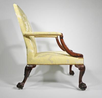 A GEORGE II STYLE MAHOGANY LIBRARY ARMCHAIR