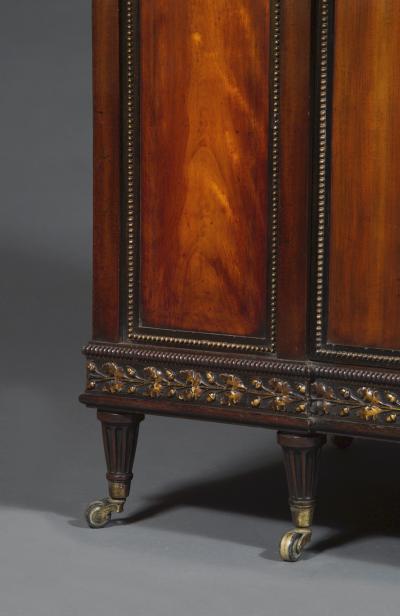 A GEORGE III MAHOGANY AND SATIN BIRCH COMMODE