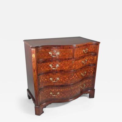 A GEORGE III STYLE MAHOGANY AND MARQUETRY CHEST OF DRAWERS