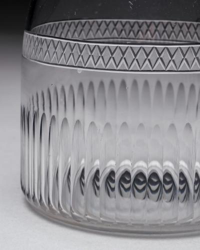 A GEORGIAN BROAD FINE FLUTE MAGNUM CARAFE AND MATCHING GLASSES