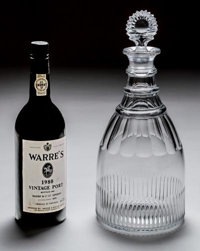 A GEORGIAN SLICE FLUTE MAGNUM DECANTER WITH SUNBURST STOPPER