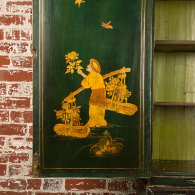 A George I green Japanned and parcel gilt lacquer bureau cabinet