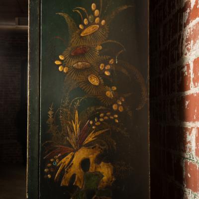 A George I green Japanned and parcel gilt lacquer bureau cabinet