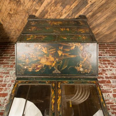 A George I green Japanned and parcel gilt lacquer bureau cabinet