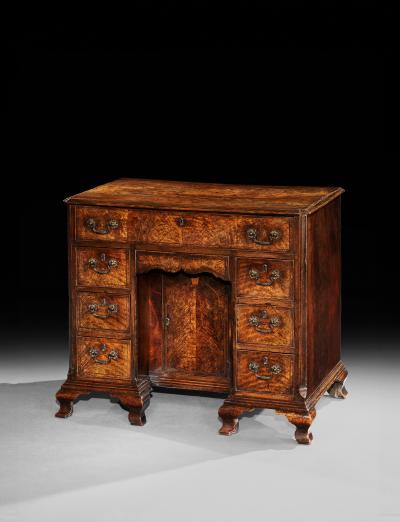 A George II Fiddleback Walnut Kneehole Desk