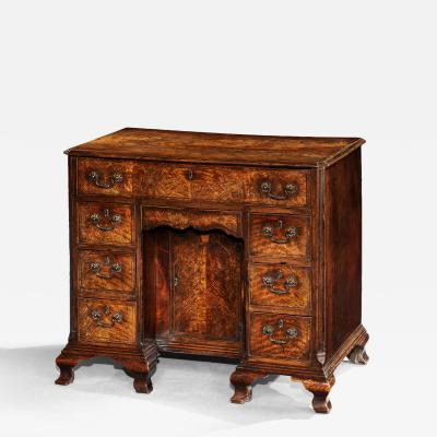 A George II Fiddleback Walnut Kneehole Desk