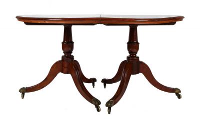 A George III Two Part Tilting Demi Lune Section Mahogany Dining Table