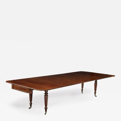 A George IV campaign dining table by Charles Stewart with five additional leaves