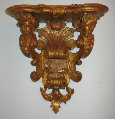 A Gilded Wood Bracket console dapplique 