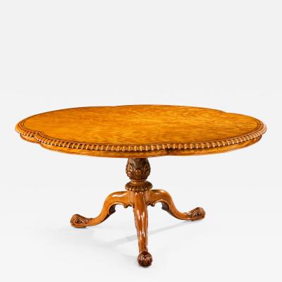 A Gillow satinwood centre table
