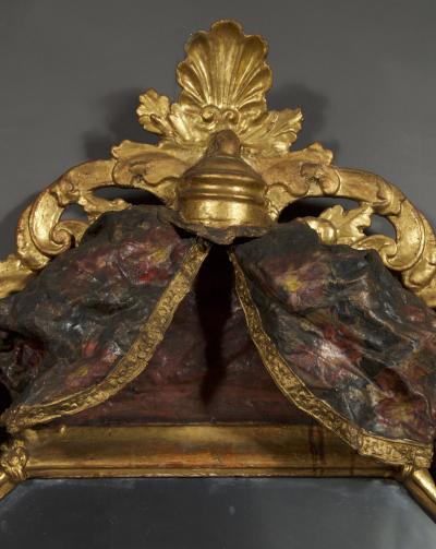 A Giltwood Octagonal Mirror With Floral Painted Canopy Crest