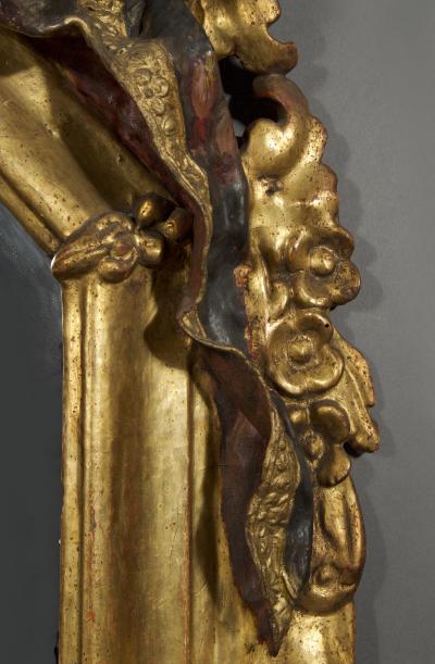 A Giltwood Octagonal Mirror With Floral Painted Canopy Crest