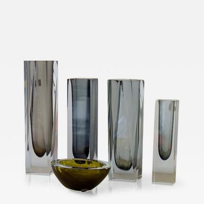 A Group of Four Charcoal Vases and an Ashtray