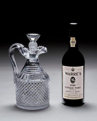 A HEAVILY CUT REGENCY CLARET JUG