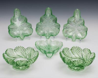 A HIGHLY UNUSUAL SUITE OF GREEN FEATHER CUT WILLIAM IV BOWLS