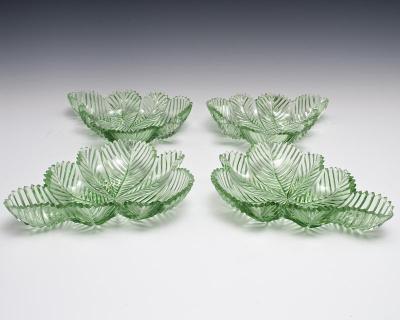 A HIGHLY UNUSUAL SUITE OF GREEN FEATHER CUT WILLIAM IV BOWLS