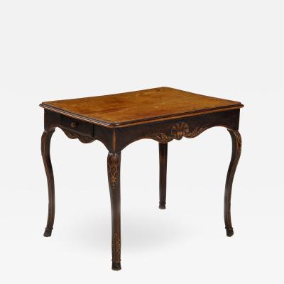A Hammered Leather and Walnut Table