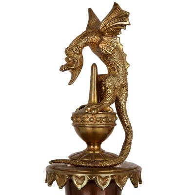 A Japonisme gilt bronze and brass three piece clock set