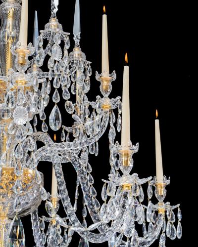 A LARGE GEORGE III STYLE 12 LIGHT CRYSTAL CHANDELIER