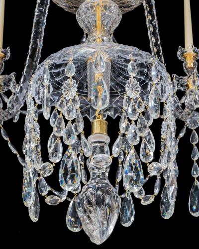 A LARGE GEORGE III STYLE 12 LIGHT CRYSTAL CHANDELIER