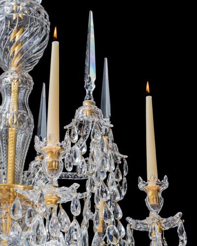 A LARGE GEORGE III STYLE 12 LIGHT CRYSTAL CHANDELIER