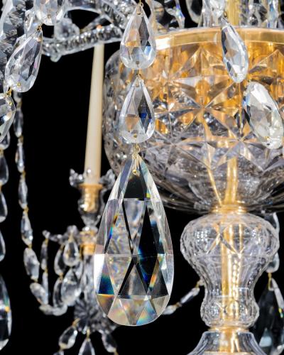 A LARGE GEORGE III STYLE 12 LIGHT CRYSTAL CHANDELIER