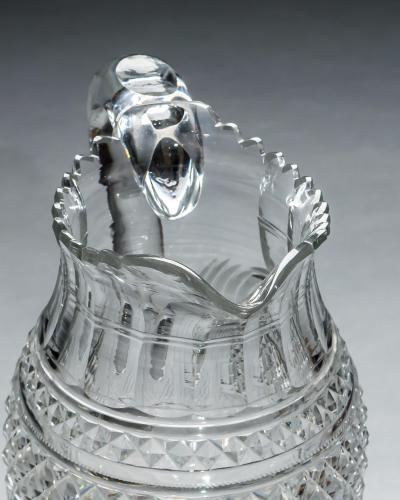 A LARGE PEDESTAL WATER JUG