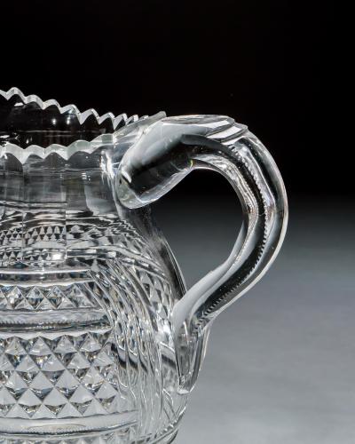 A LARGE PEDESTAL WATER JUG