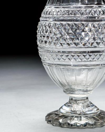 A LARGE PEDESTAL WATER JUG