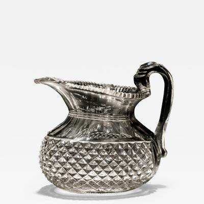 A LARGE REGENCY DIAMOND CUT OVAL JUG