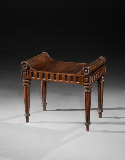 A LATE REGENCY PERIOD CARVED MAHOGANY HALL STOOL CARVED BY RICHARD PENN