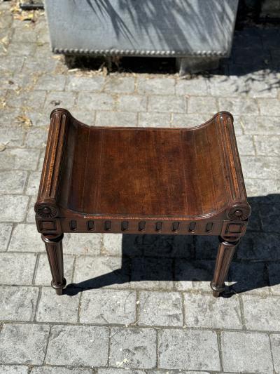 A LATE REGENCY PERIOD CARVED MAHOGANY HALL STOOL CARVED BY RICHARD PENN