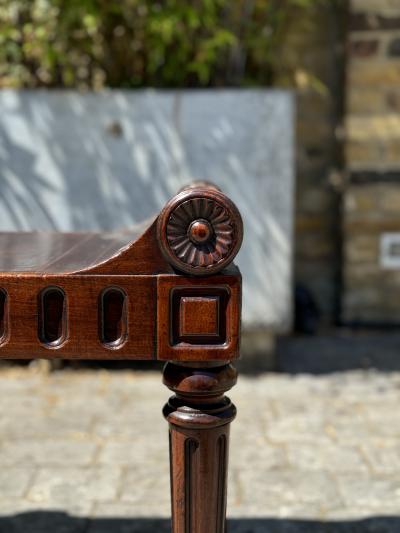 A LATE REGENCY PERIOD CARVED MAHOGANY HALL STOOL CARVED BY RICHARD PENN