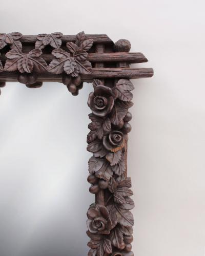 A Large 1880s Hand Carved Black Forest Mirror