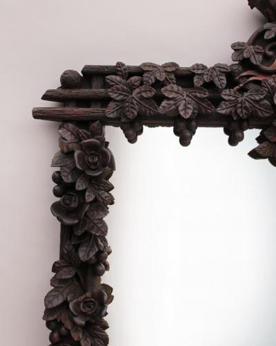 A Large 1880s Hand Carved Black Forest Mirror
