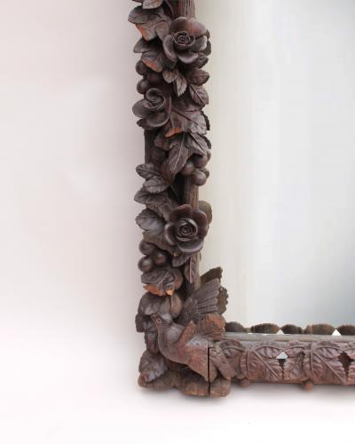 A Large 1880s Hand Carved Black Forest Mirror
