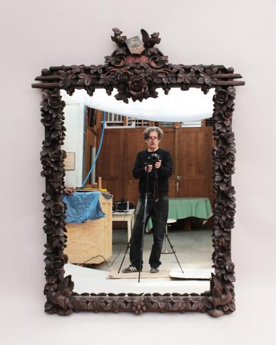 A Large 1880s Hand Carved Black Forest Mirror