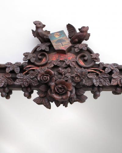 A Large 1880s Hand Carved Black Forest Mirror