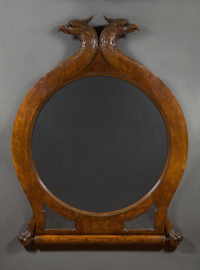 A Large Carved Oak Mirror Surmounted By Addorsed Eagle Heads