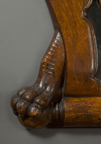 A Large Carved Oak Mirror Surmounted By Addorsed Eagle Heads