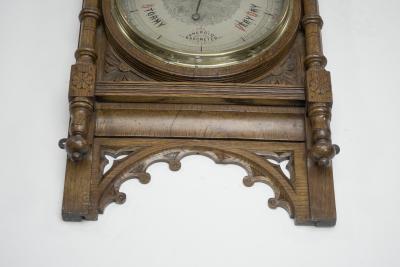 A Large Gothic Revival Carved Oak Barometer with a Rare Snail Tail Thermometer