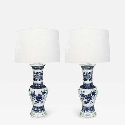 A Large Pair of Chinese Blue and White Baluster form Vases now as Lamps