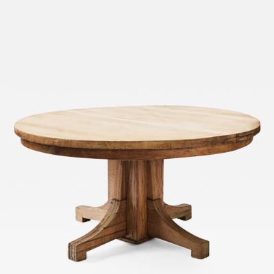 A Large Round Oak Dining Table