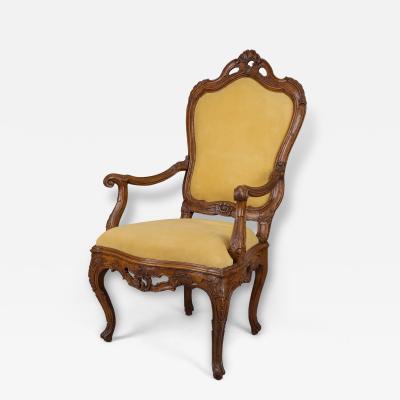 A Large Walnut Openwork Carved Venetian Armchair