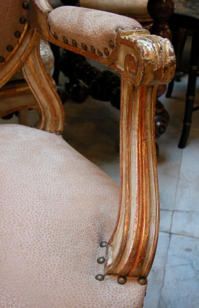 A Large scaled French Louis XVI Style Ivory Painted and Parcel Gilt Armchair